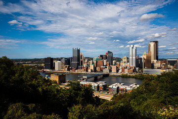 Fototapeta na wymiar Downtown Pittsburgh, PA, USA, with Monongahela River, saturated colors, sky and clouds.