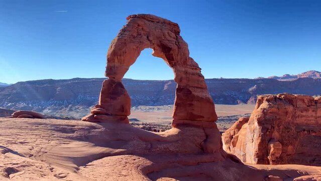 Slow pan of Delicate Arch rock formation