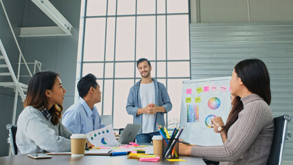 Businessman presenting business plan information to team at office meeting, Creative man leader...