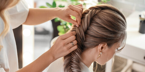 Fototapeta premium Hairdresser working with client in beauty salon