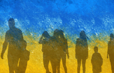 Double exposure of Ukrainian flag and silhouettes of refugees