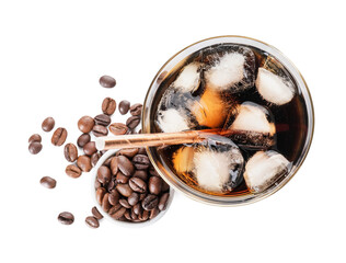 Glass of cold brew with straw and coffee beans on white background