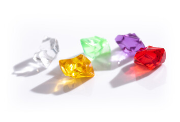Colorful spiritual crystals with reflecting on the white background , Toy or interior background