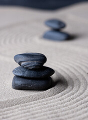 Fototapeta na wymiar Zen garden japanese garden zen stone with zen pattern in sand as background