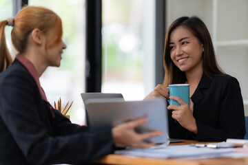 Cheerful business people discussing or brainstorming about marketing plan and financial of company. Account concept.