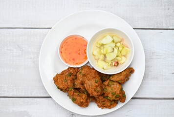 fish cakes on white plate , fried fish paste balls with sauce - Asian Thai food