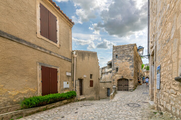 Fototapeta na wymiar Typical stone street in the medieval old town of Les-Baux-de-Provence in the Alpilles Mountains of the Alpes-Provence region of Southern France.