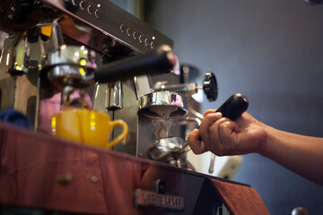 Coffee Machine. The process of cleaning the group head and portafilter with coffee machine hot water.