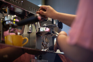 Coffee machine removes hot water from the group head to wash the portafilter after it is used to make espresso.