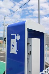 Electrical vehicle charging station in parking lot