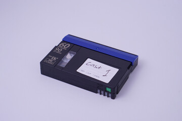 high angle view, Front isometric view of Mini DV video cassette tape isolate on white studio...