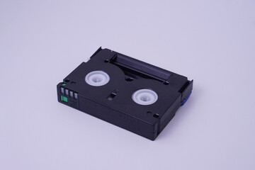 high angle view, Back isometric view of Mini DV video cassette tape isolate on white studio...