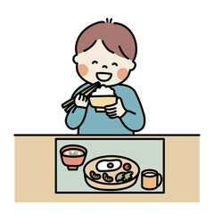 茶碗を持って食べる男の子