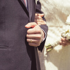 Groom with a wedding ring close-up
