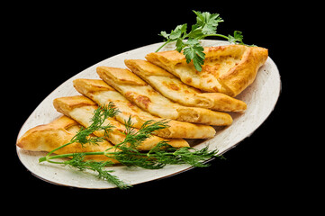 turkish pizza pide with meat on a black isolated background