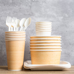 Eco friendly food packaging on table background. natural container: cup, plate, spoon and fork. zero waste, pollution, earth day, free plastic, world Environment day concept