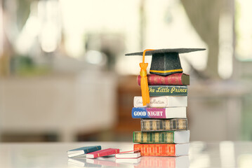 Graduate study abroad program to broaden learner's world view, education concept Graduation cap,...
