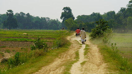 man going from bike image