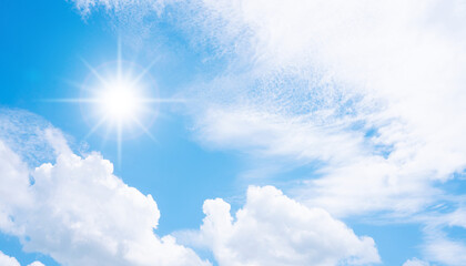 Sun in blue sky with cloud.