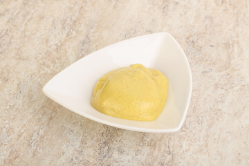 Organic mustard sauce in the bowl