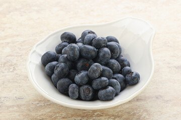 Sweet ripe blueberry heap in the bowl