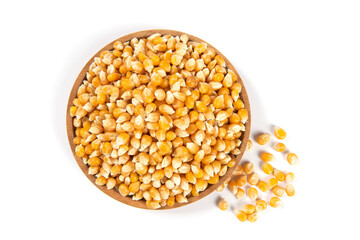 dry corn in plate isolated on white background.Unpopped popcorn