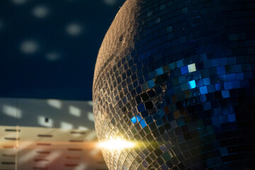 Disco ball in a dark room. Party and having fun concept in a club. Popular disco style item. Sphere...