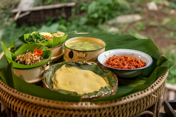 Northern Thai food set consisting of omelette, boiled soup, chili paste, boiled vegetables