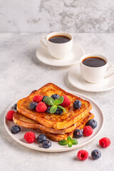 French toast with blueberries, raspberries, maple syrup