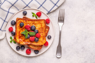 French toast with blueberries, raspberries, maple syrup