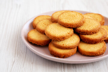 Homemade Pure Butter Shortbreads on a Pink Plate, side view. Copy space.