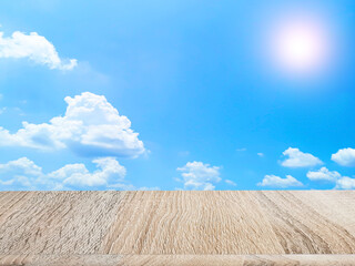 Wooden floor for placing products. View of the sky behind.