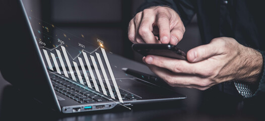 Businessman plan graph growth increase of chart positive indicators in his business