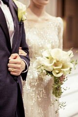 A close-up image of wedding ring of groom in wedding venue