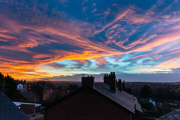Sunset over city of Wakefield UK shot from the roof tops