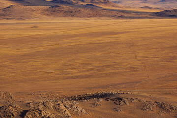 Fototapeta na wymiar Gobi desert lifeless landscape mountains Altai Republic Russia, texture of red sandstone in Mars valley