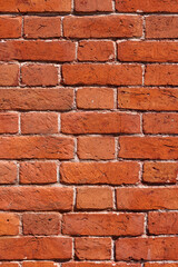 Fototapeta premium Well-preserved wall made of old clay bricks.