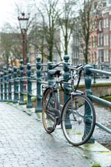 Fototapeta na wymiar Bike on a railing on Amsterdam