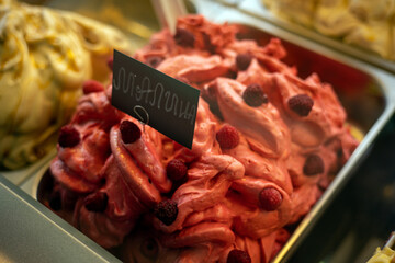 ice cream in iron trays on the store counter
