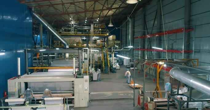 Workshop of the non-woven fabrics factory. Production of nonwoven materials. Modern shop of nonwoven materials. industrial interior