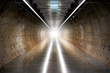 Abstract blurred light waves in a tunnel. Hope at the end of the tunnel. Long dark tunnel with...