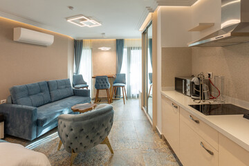 Interior of a modern new kitchen with dining table and chairs in the morning