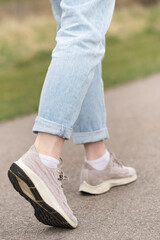 Fototapeta premium Closeup of the feet, shoes and legs of a woman