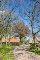 Cobblestoned road leading to an old farm in Orvelte, Netherlands