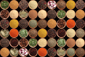 Collection of different aromatic spices and herbs on black background, flat lay