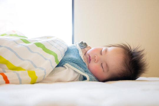 Baby taking a nap. Inside a house in Japan.