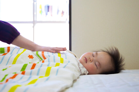 Baby taking a nap. Inside a house in Japan.
