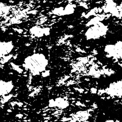 Fototapeta premium The texture is chaotic monochrome of black spots on a white background