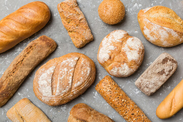 Homemade natural breads. Different kinds of fresh bread as background, top view with copy space