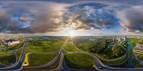 aerial full spherical seamless hdr 360 panorama over huge road junction of freeway at height of 100 meters at susnset in equirectangular projection, VR AR content